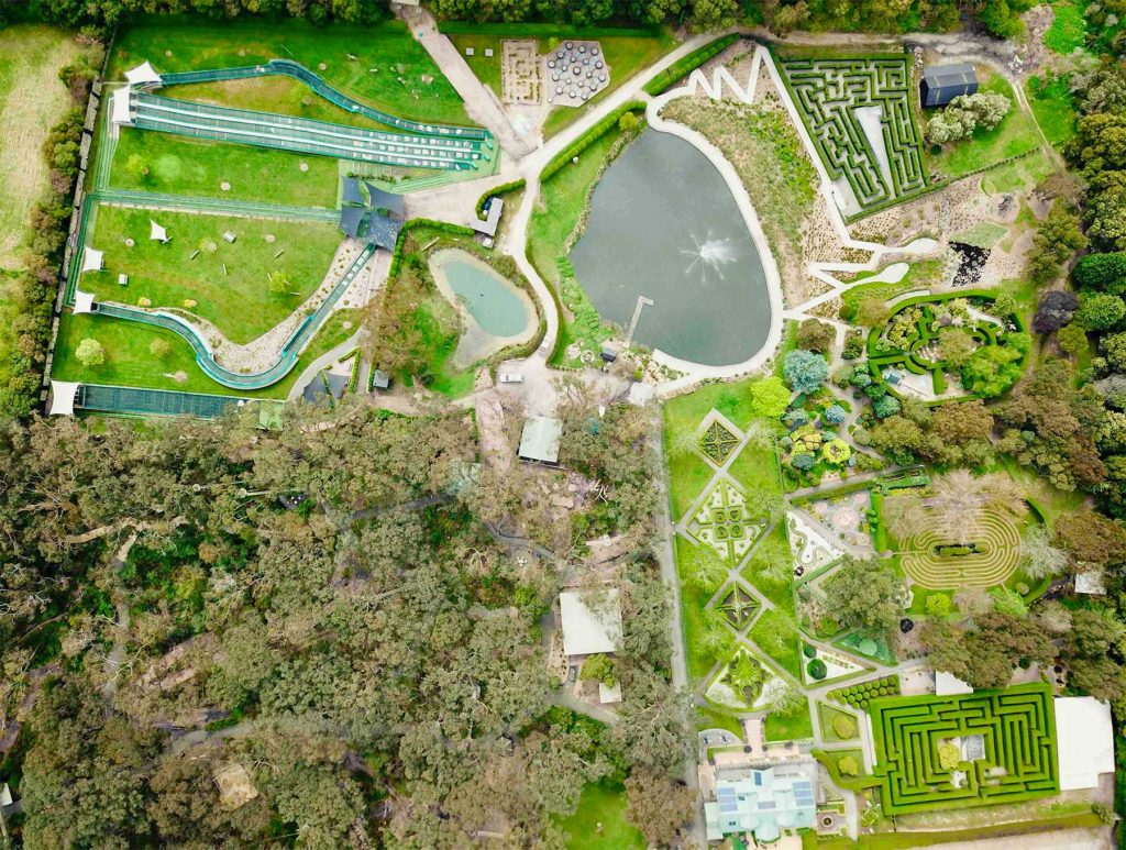 Aerial view of Enchanted Adventure showing lake, tube slides, mazes and gardens